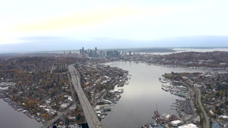 wide drone shot of lake union connecting all of seattle's meandering neighborhoods