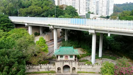 Pok-Ngar-Villa-ornate-gatehouse-remains,-Sha-Tin-area-in-Hong-Kong,-Aerial-view