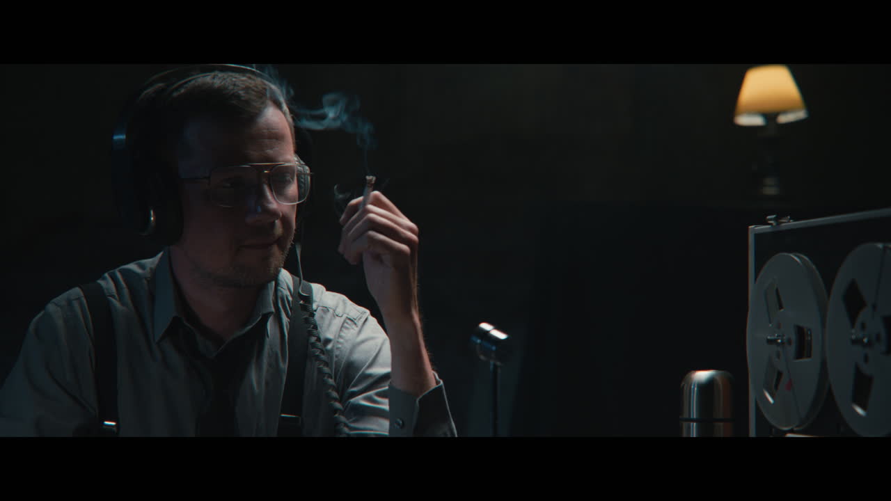 An intelligence officer listens to the wiretap recordings