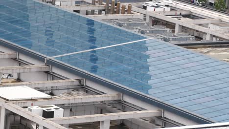 glass rooftop of a commercial building with ventilation systems