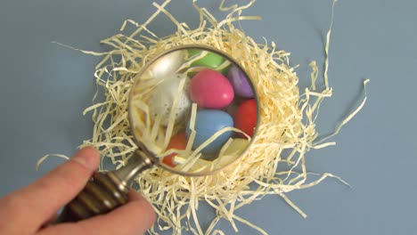 magnifying glass over easter eggs