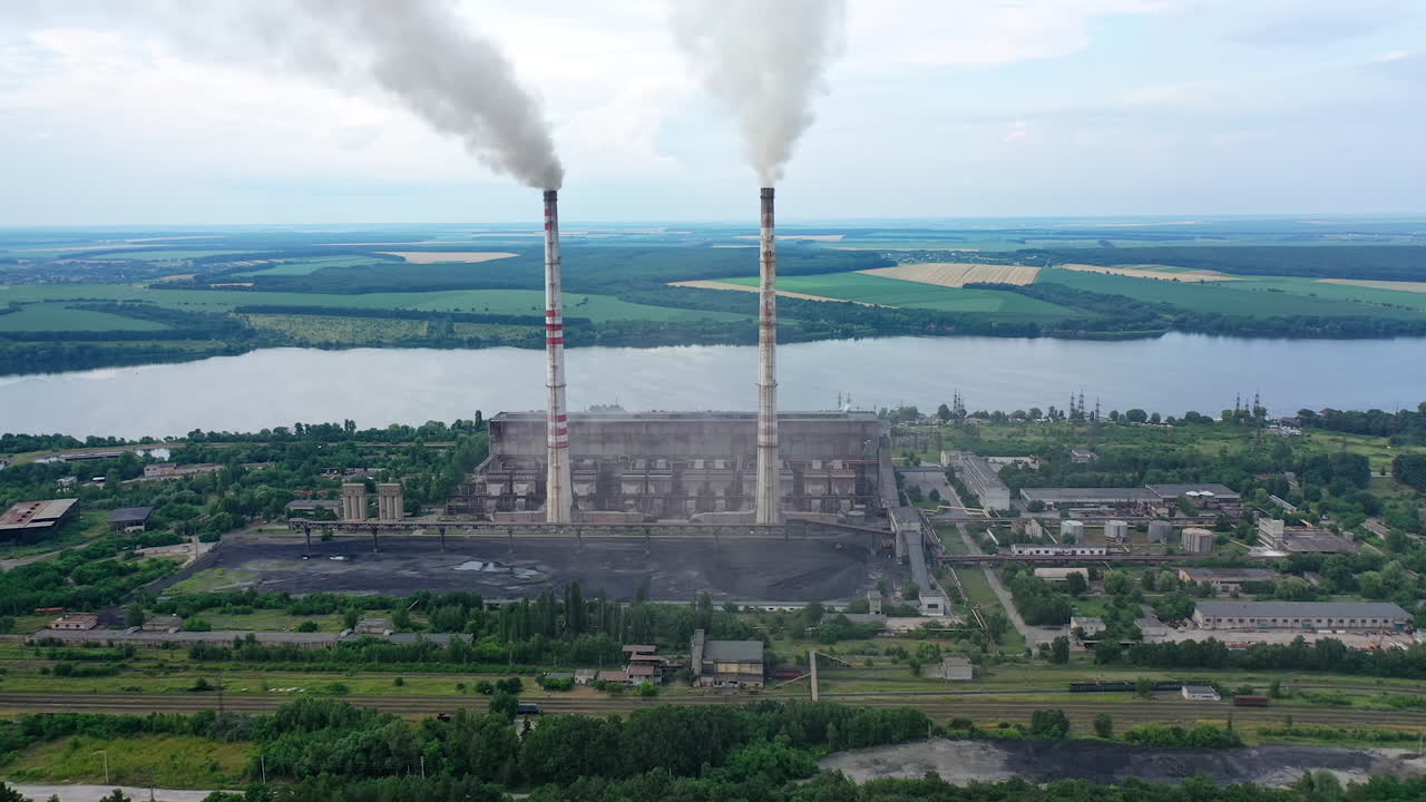 Industrial architecture factory warehouses. Aerial view of big factory territory with huge tubes.