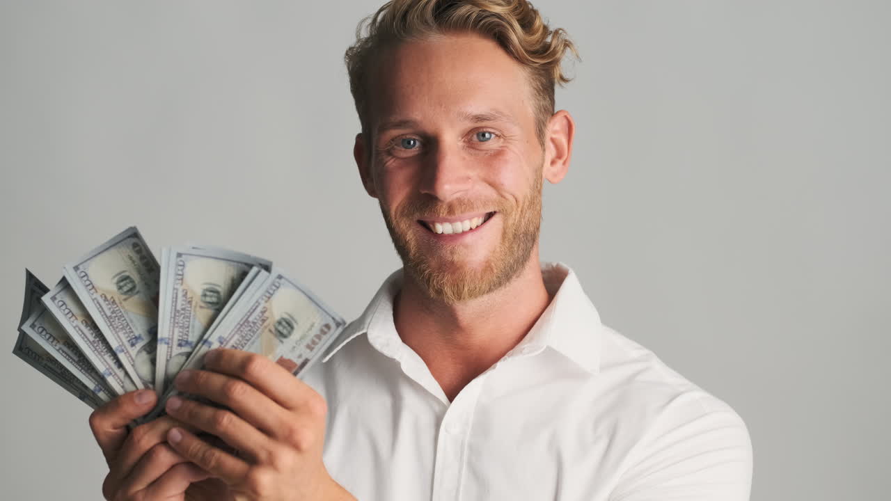 Young man counting banknotes