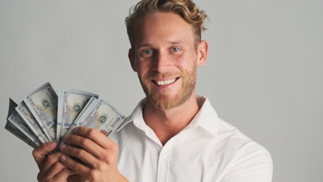 young man counting banknotes