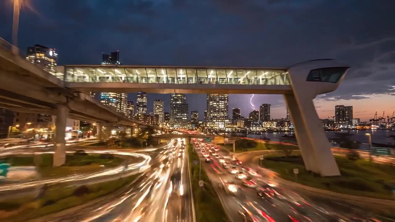 Urban Cityscape at Dusk: An Engaging View of Skyscrapers, Traffic, and Lighting Strikes Beneath an Impressive Sky, Capturing the Energy of City Life in Motion