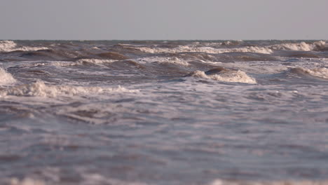 sea waves rushing at the beach