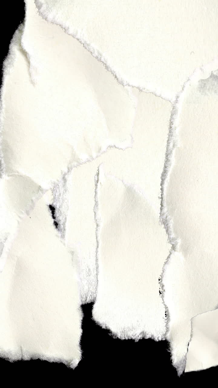 Torn White Paper Pieces Appearing and Disappearing