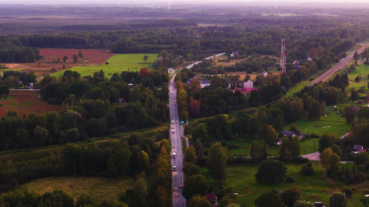 Aerial View of a Country Road with Cars and Railway Tracks