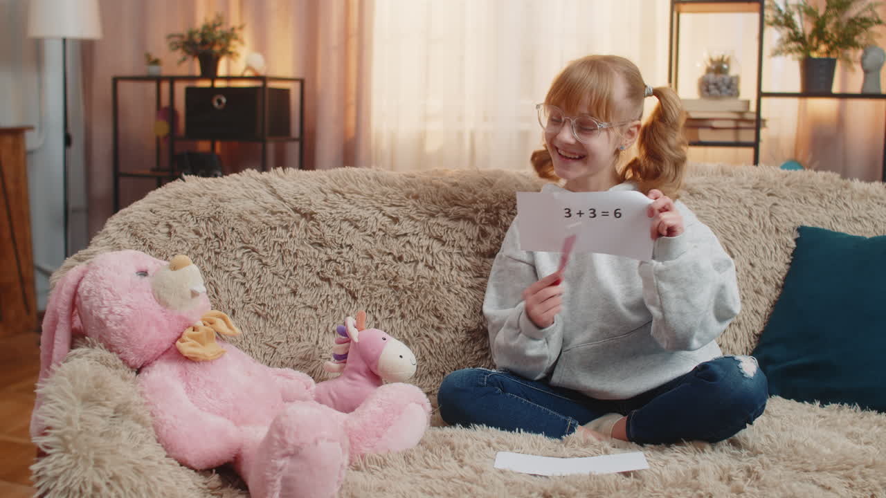 Young teenager girl pretending teacher at home sofa math lesson toy students playful serious act