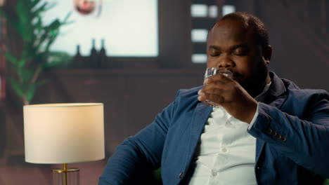 classy gentleman getting a bit drunk with hiccups from strong blended whiskey