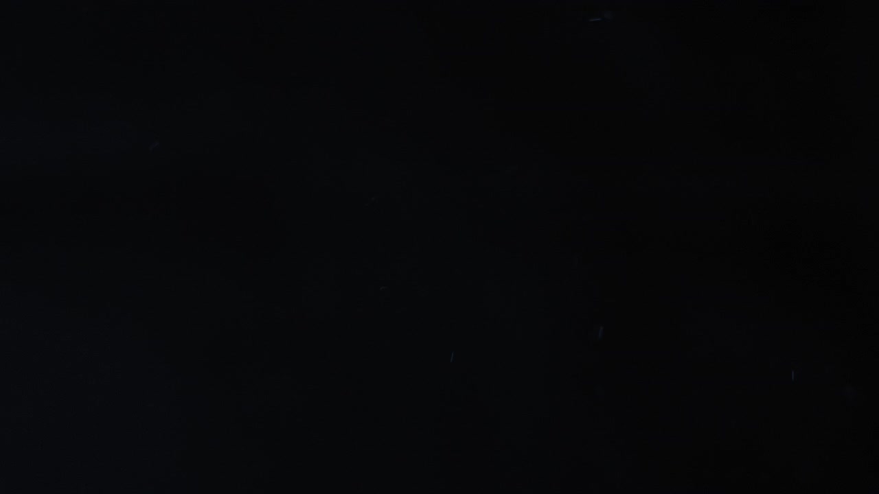 Abstract Blue Light Streaks on Black Background