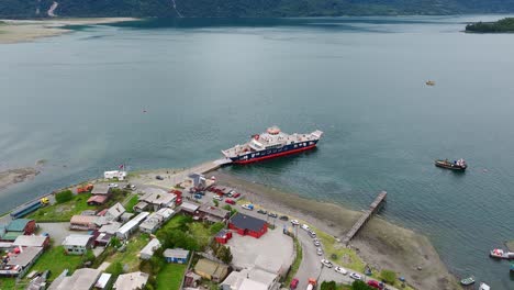 Aerial-View-Of-Ferry-Boat-Docked-At-Ramp-In-Hornopiren-Town-Located-In-Commune-Of-Hualaihué-in-Palena-Province,-Southern-Chile