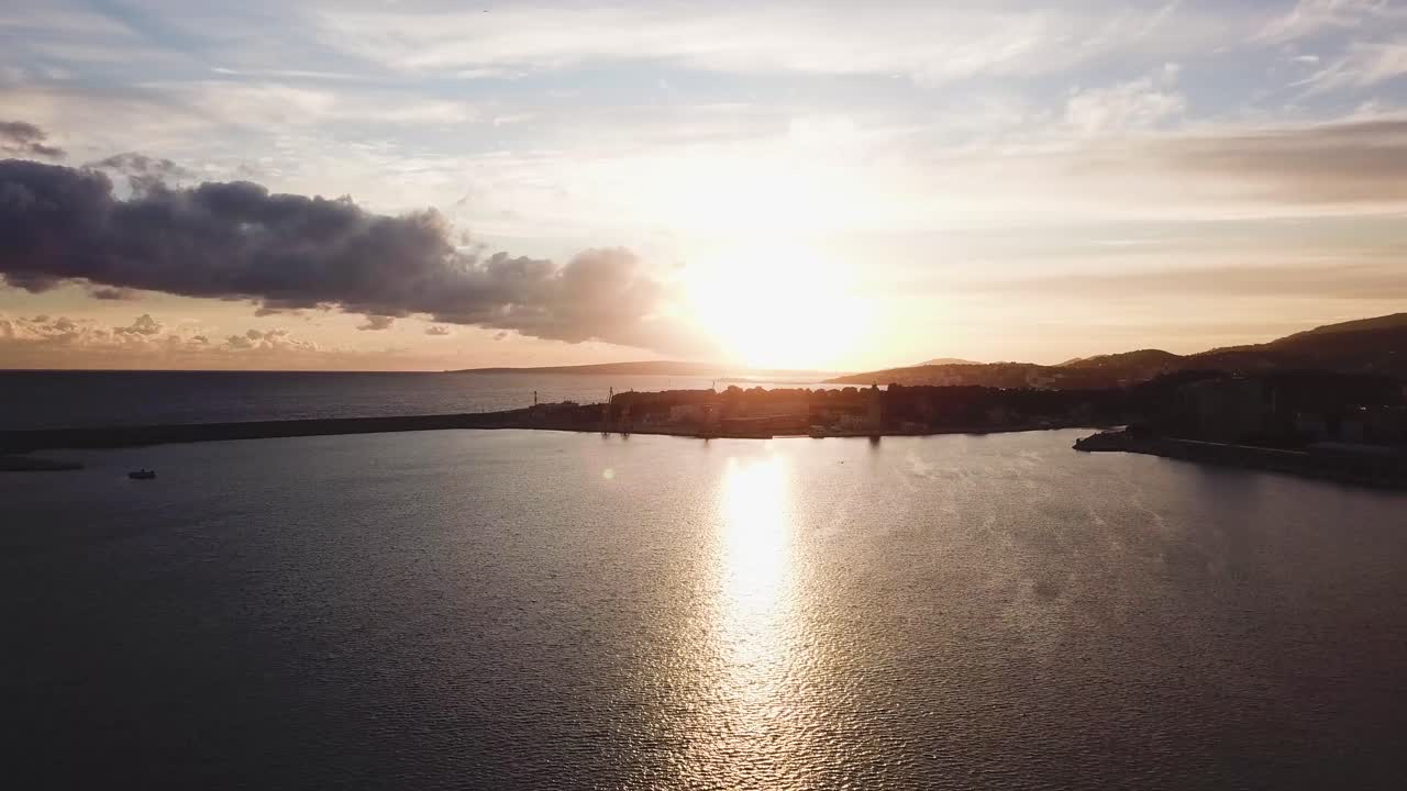 Sunset over Coastal City Harbor