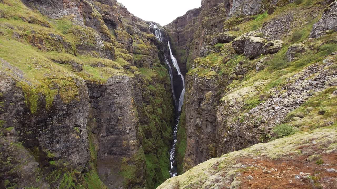 View of the Glymur waterfall on the Botsn&aacute; river from the Hvalvatn lake near the Hvalfj&ouml;r&eth;ur fjord - Iceland
