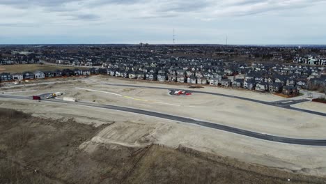 Aerial-view-of-a-modern-suburban-community-in-Calgary,-Canada,-in-spring-after-the-snow-melt