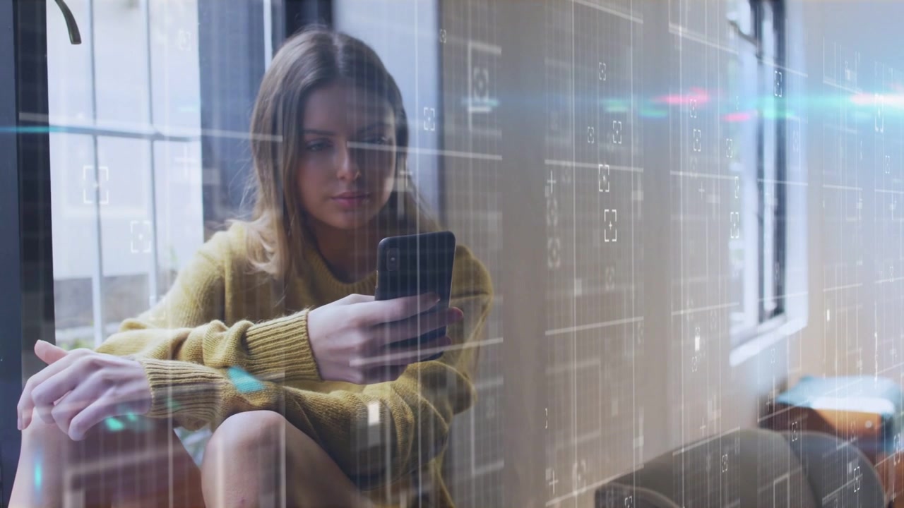Donna al posto vicino al finestrino che tocca lo smartphone, creando una griglia digitale che scorre sullo schermo per una demo tecnologica.