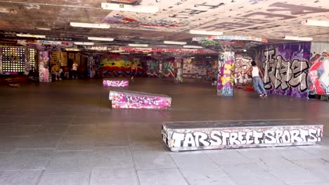 skateboarder performing tricks in urban art space