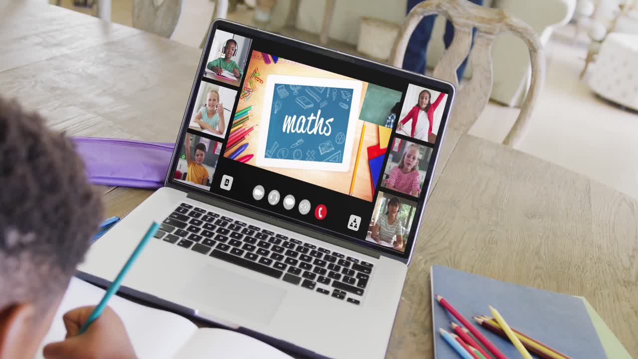 Composition of african american boy on laptop online learning with maths text