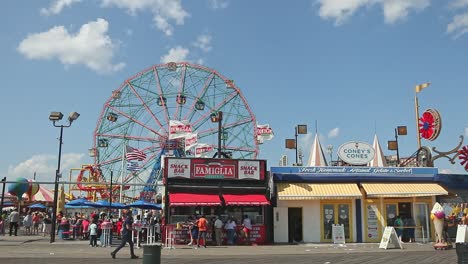 coney island boardwalk with wonder wheel and food stalls