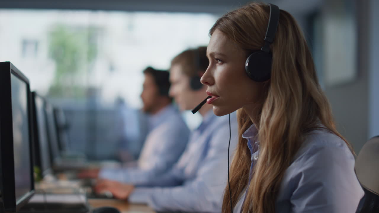 Service desk coworkers consulting clients online sitting company space closeup