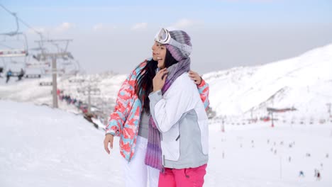 Two-pretty-young-female-friends-at-a-ski-resort