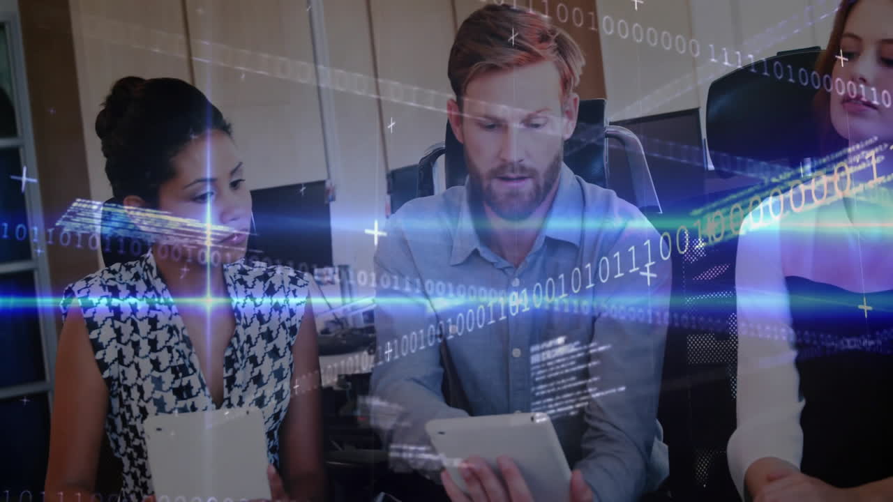 office workers collaborating at desk in tech office, featuring binary code and light flare overlays