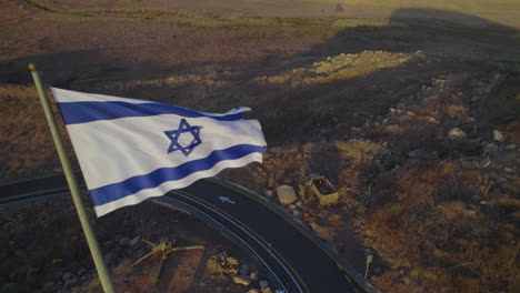 the israeli flag found on a volcano where they built a bunker with large combat equipment, the site of one of the most critical battles of the yom kippur war on 1973