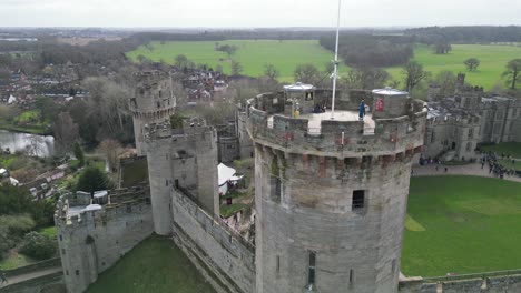 rising drone aerial warwick castle tower warwickshire english flag reveal