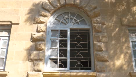 Old-window-of-a-hospital-with-broken-glass-in-Karachi