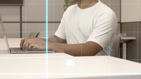 young black adult male on a computer with graphic overlay of a chart moving up.