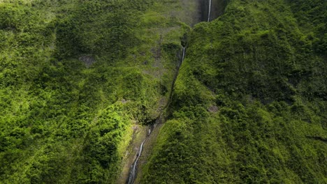 Aerial-view-of-a-waterfall-on-the-side-of-a-big-mountain-on-the-Reunion-Island