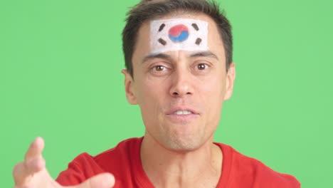 close up of a man supporting south korean team