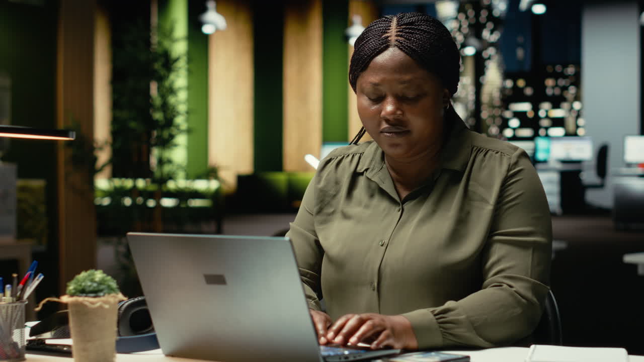 Female advisor engaged in reading emails and documenting updates