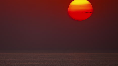 timelapse shot of beautiful red sunrise over the sea during morning time