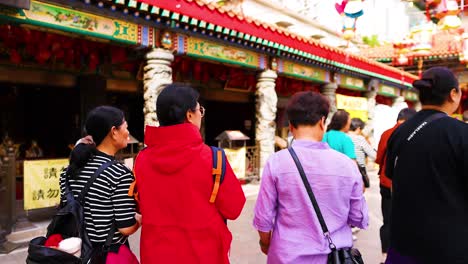 people exploring the temple in hong kong