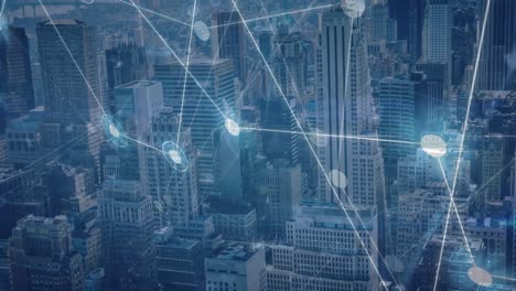 animation of network of connections and data processing against aerial view of cityscape