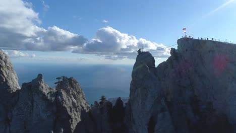 mountain peak with people and flag