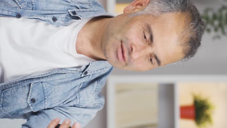 Vertical-video-of-Man-shopping-on-the-phone.