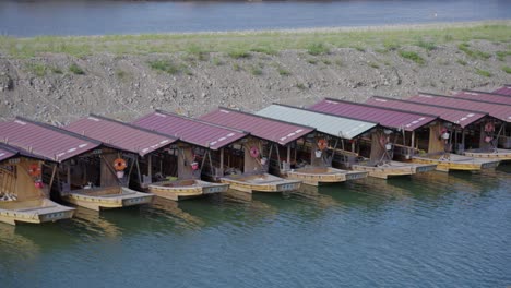 rows of ukai cormorant fishing boats along the nagaragawa river, gifu japan