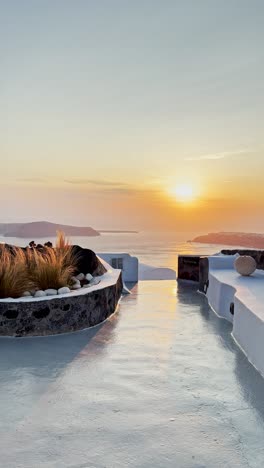 santorini rooftop pathway bathed in golden sunset light