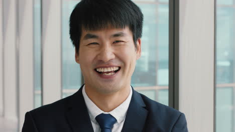 portrait-asian-businessman-laughing-happy-male-executive-in-office-enjoying-successful-career-in-corporate-leadership-company-manager-at-work