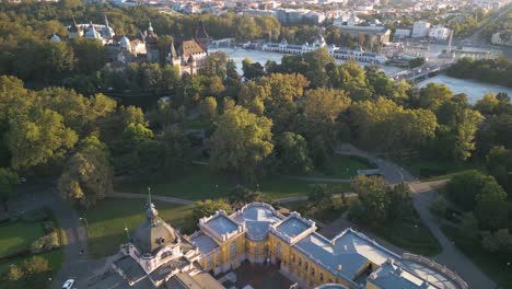 aerial pullback reveals szechenyi thermal baths, budapest, hungary