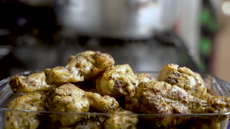 the sight of steam rising off freshly cooked chicken meat, showcased in a close-up bowl shot, evokes the anticipation of delicious food preparation