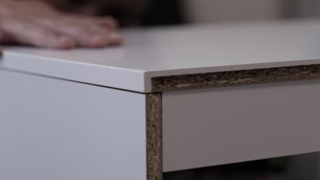 fastening tabletops from chipboard to special fasteners. wood furniture assembly