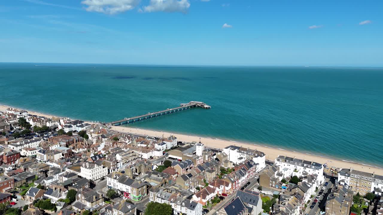 Panning drone aerial Deal seaside town seafront Kent UK blue sky summer