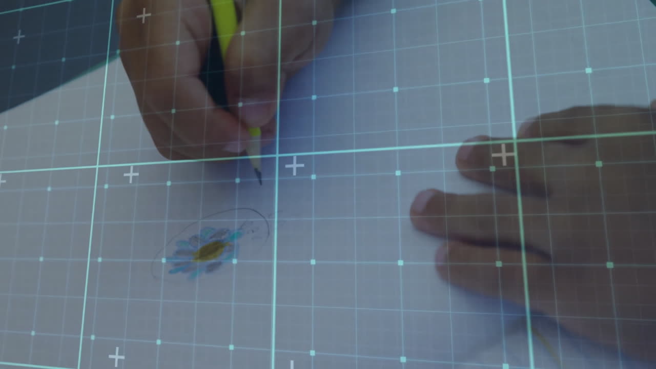 Hand gripping yellow pencil sketching colorful doodle on white paper with turquoise grid overlay