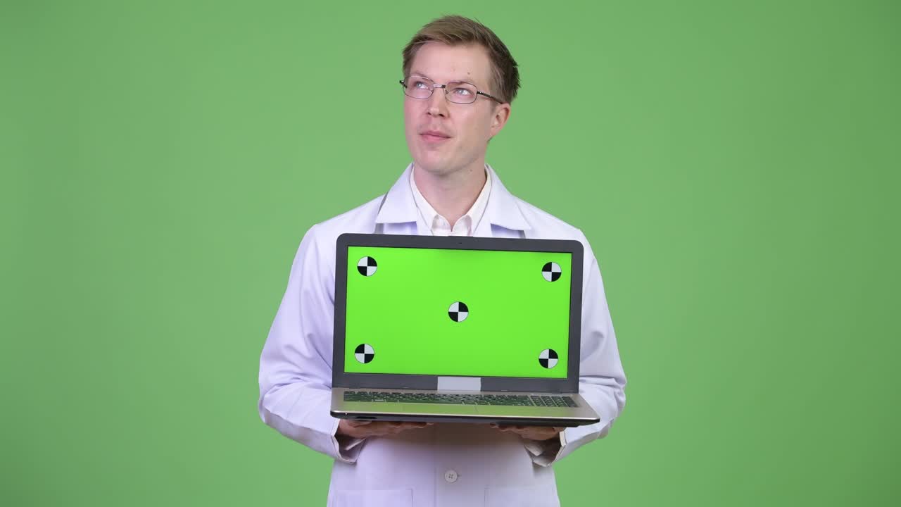 Happy Man Doctor Thinking And Showing Chroma Key Green Screen Laptop Computer