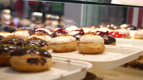 assortment of delicious donuts in a bakery display