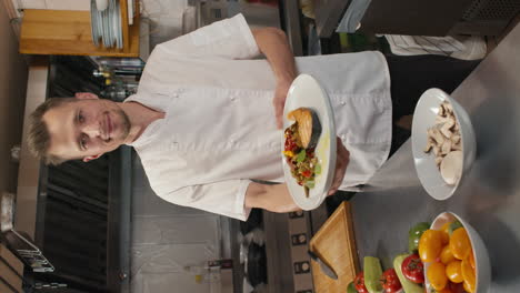chef with prepared dish on plate