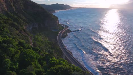 famous iconic sea cliff bridge sunrise aerial drone view stanwell park south coast nsw australia cars driving picturesque landscape royal national park wollongong coalcliff iiawarra sydney forward